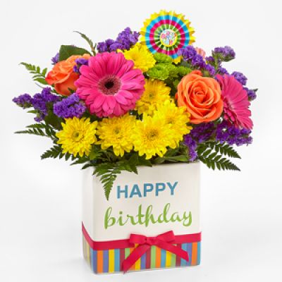 <div class="summary entry-summary">
<div class="woocommerce-product-details__short-description">

The FTD® Birthday Brights™ Bouquet is a true celebration of color and life to surprise and delight your special recipient on their big day! Hot pink gerbera daisies and take center stage surrounded by purple gilly flowers, yellow chrysanthemums, orange carnations, green button poms, bupleurum, and lush greens to create party perfect birthday display. Presented in a modern rectangular ceramic vase with colorful striping at the bottom, “Happy Birthday” lettering at the top, and a bright pink bow at the center, this unforgettable fresh flower arrangement is then accented with a striped happy birthday pick to create a fun and festive gift.

</div>
</div>
<div class="woocommerce-tabs wc-tabs-wrapper">

 

</div>