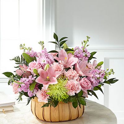 Let them know how much you care with a gorgeous bouquet that features carnations, stock, roses, lilies and Fuji mums. Each bloom is a thoughtful reminder of your support and love, while sitting in a beautifully crafted basket.