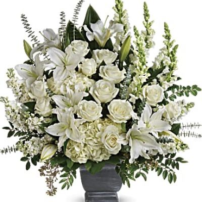 <div class="m-pdp-tabs-description">
<div id="mark-1" class="m-pdp-tabs-marketing-description">Like the sun on the horizon, this pure white bouquet of hydrangea, roses and lilies offers hope and inspiration.</div>
</div>
<p id="arrngDescp">White hydrangea, white roses, white oriental lilies, white snapdragons, and white stock are arranged with huckleberry, seeded eucalyptus, spiral eucalyptus, green ti leaves, and lemon leaf.</p>