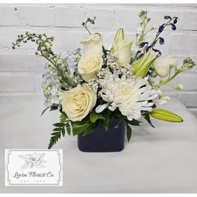 This luxurious arrangement combines the beautiful blue and white colors in a timeless assortment of flowers that are sure to enhance and delight any recipient.