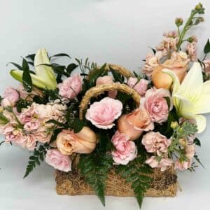 purse of petals floral arrangement in wicker purse