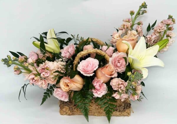 purse of petals floral arrangement in wicker purse